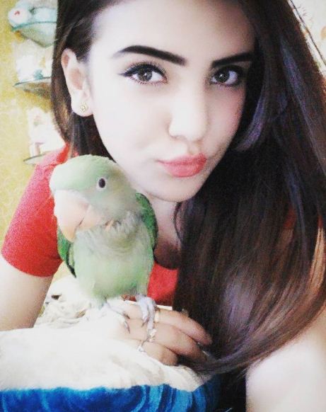 Azma Fallah with her parrot