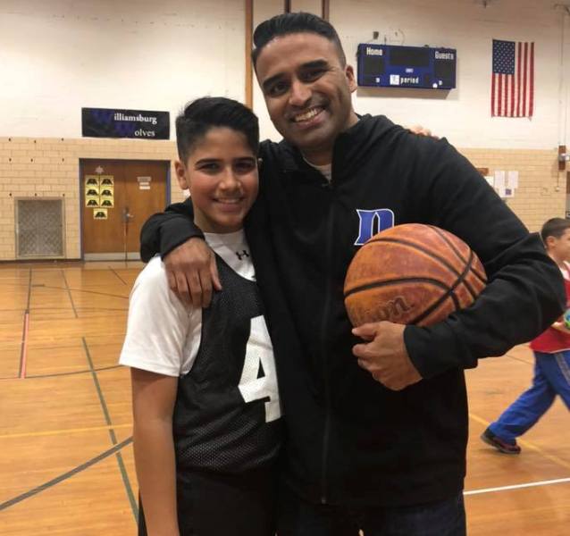 Maju Varghese playing basketball with his son