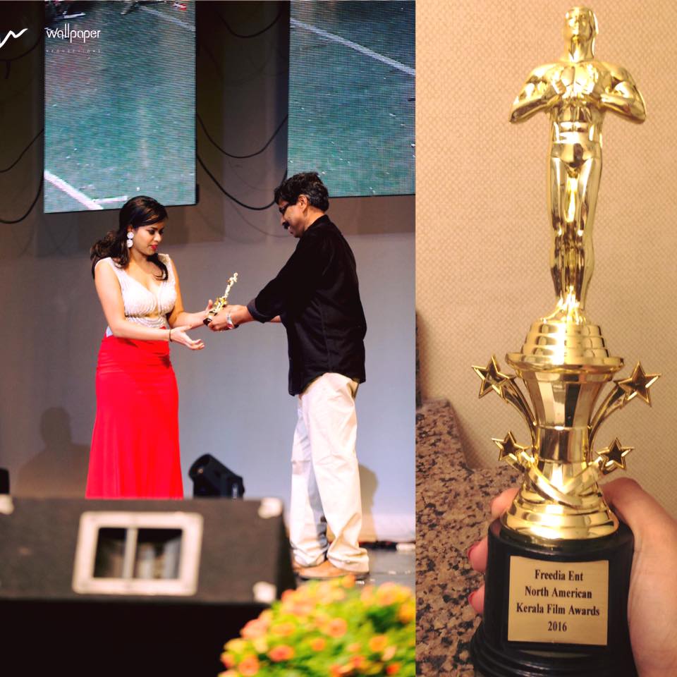 Michelle Ann Daniel receiving the Best Actress Award at North American Kerala Film Awards 2016