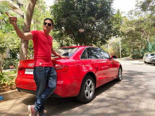 Prashanth Sambargi posing with his car
