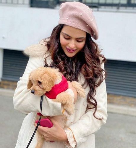 Priyanka Choudhary with a dog