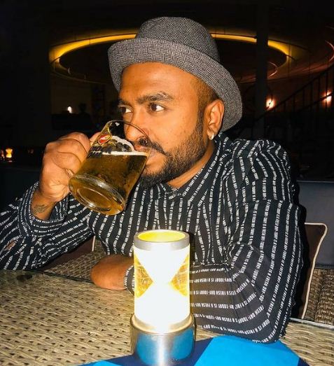 Raghu Gowda drinking beer