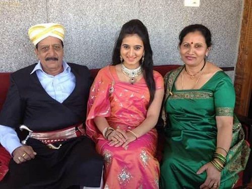 Harshika Poonacha and her parents