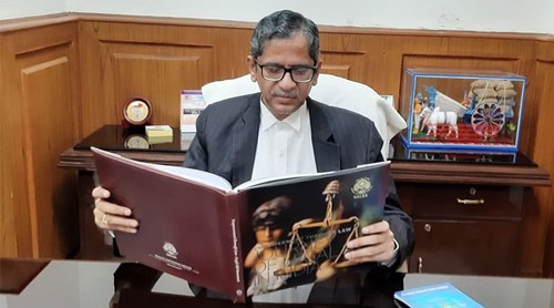Justice N. V. Ramana reading a book