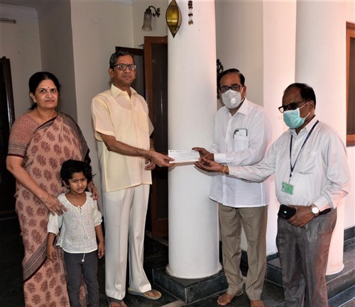 N. V. Ramana handing over the donation cheque to the authorities