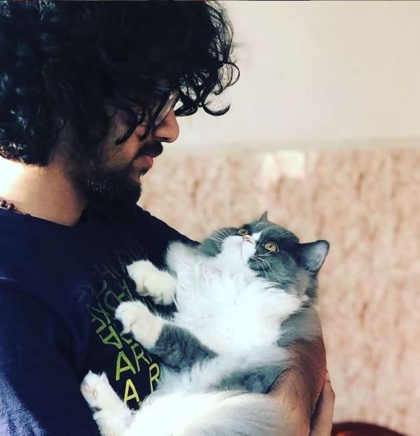 Nihal Tauro cuddling with a cat