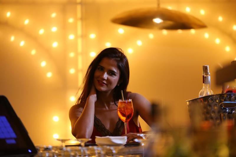 Shipra Khanna enjoying her drink at a party