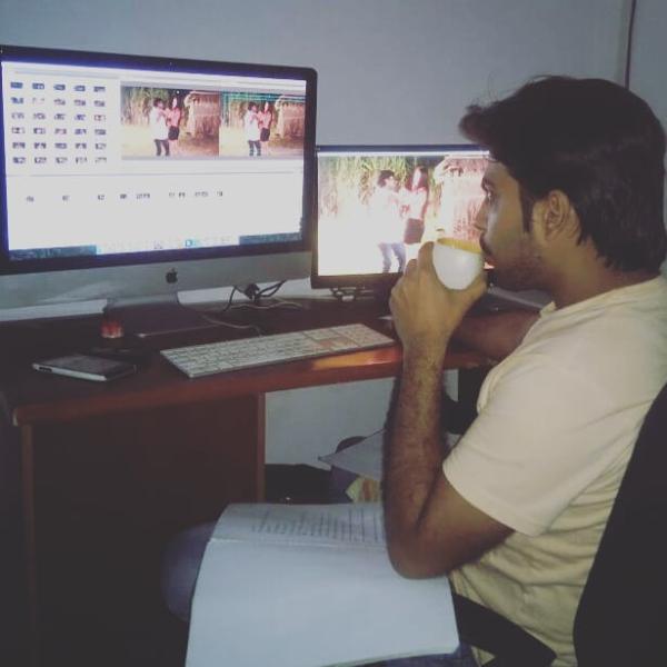 Ajay Sharma doing the editing work for a film