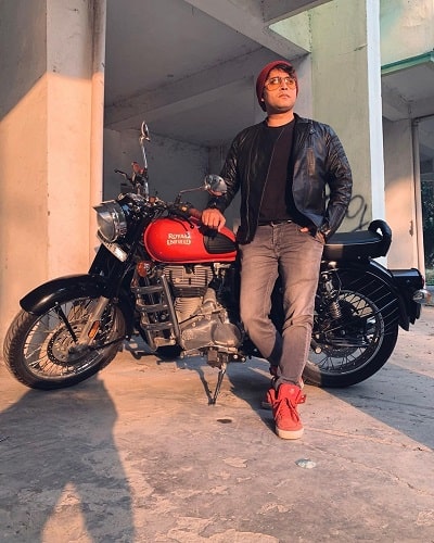 Rahul Vohra posing with his motorcycle