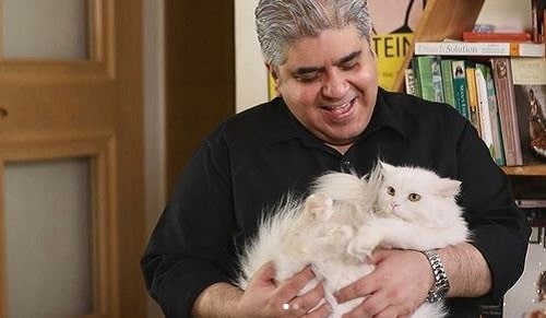 Rajeev Masand with pet cat of Richa Chadha