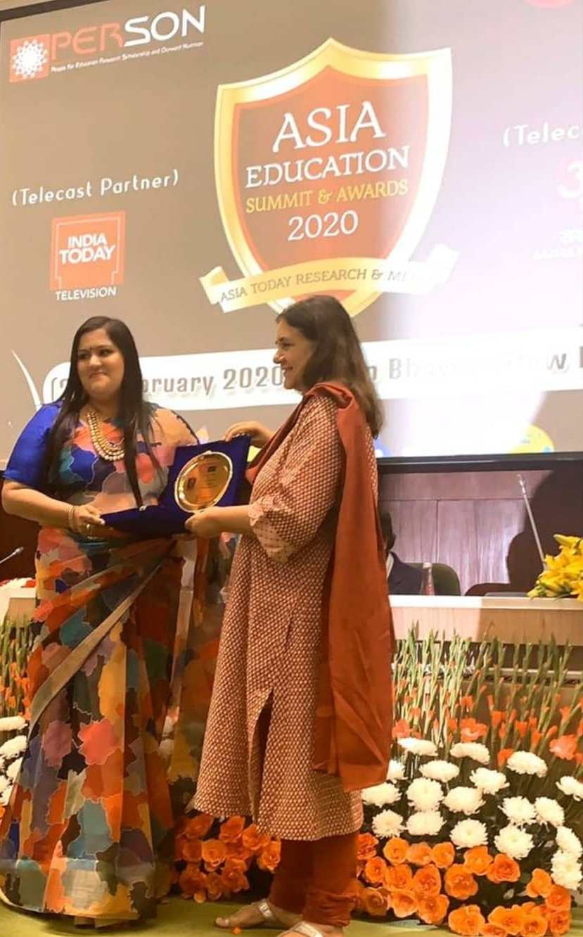 Savi Kumar with her Asia Education Summit & Award