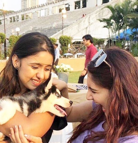 Vedika Bhandari playing with a dog