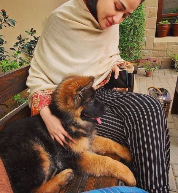 Sana Javed cuddling with her pet dog