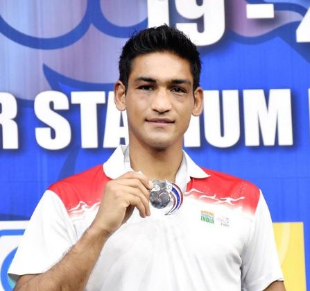 Ashish Kumar with a silver medal