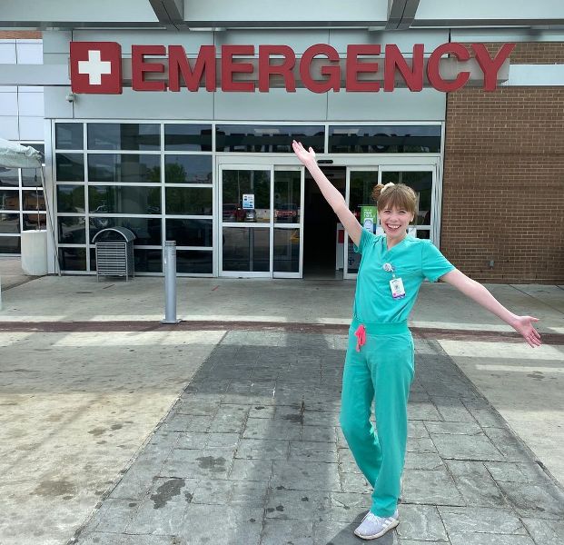 Hayley while posing outside the emergency department of her workplace