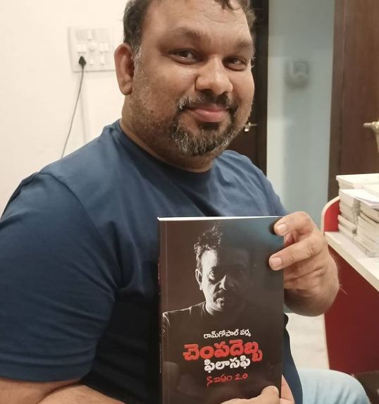 Mahesh Kathi holding the book Slap Philishopy