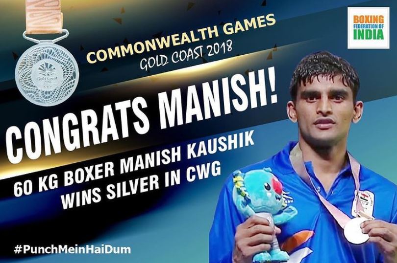 Manish Kaushik with a silver medal