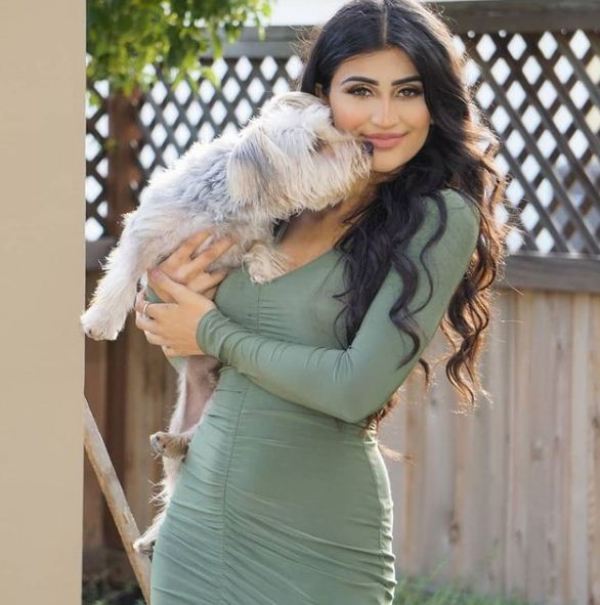 Puneet Kaur holding her pet dog
