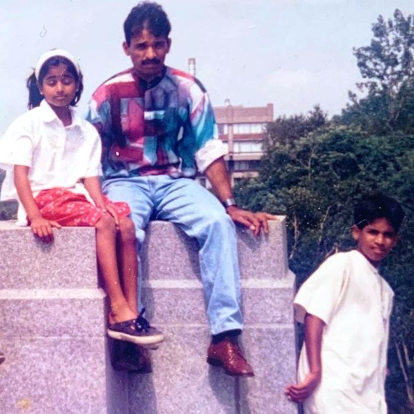 Childhood picture of Priya Ragu with her father and brother