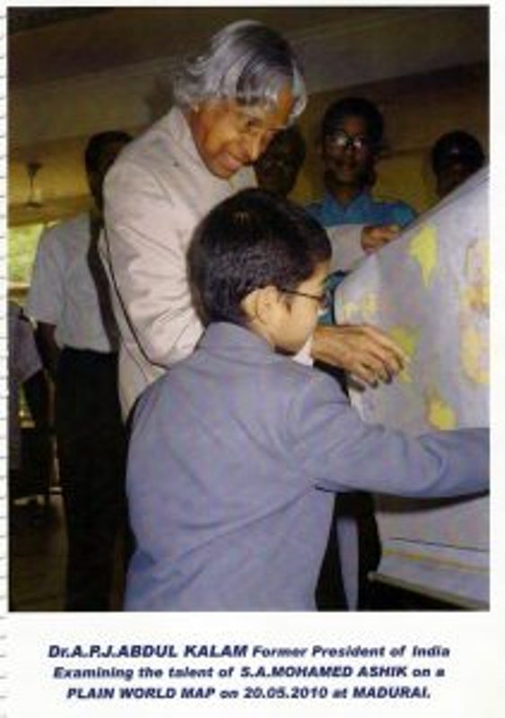 Dr A P J Abdul Kalam former president of India while examining the talent of S A Mohamed Ashik in 2010