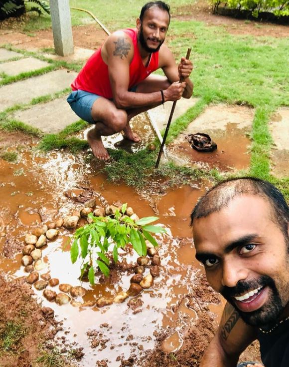 P. R. Sreejesh taking a selfie while planting a tree
