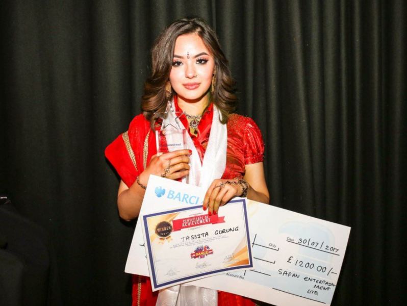 Jassita posing with her prizes after winning the dance competition in 2017