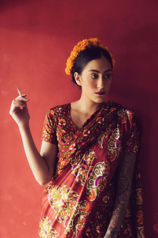 Karuna Ezara Parikh with a cigarette in her hand