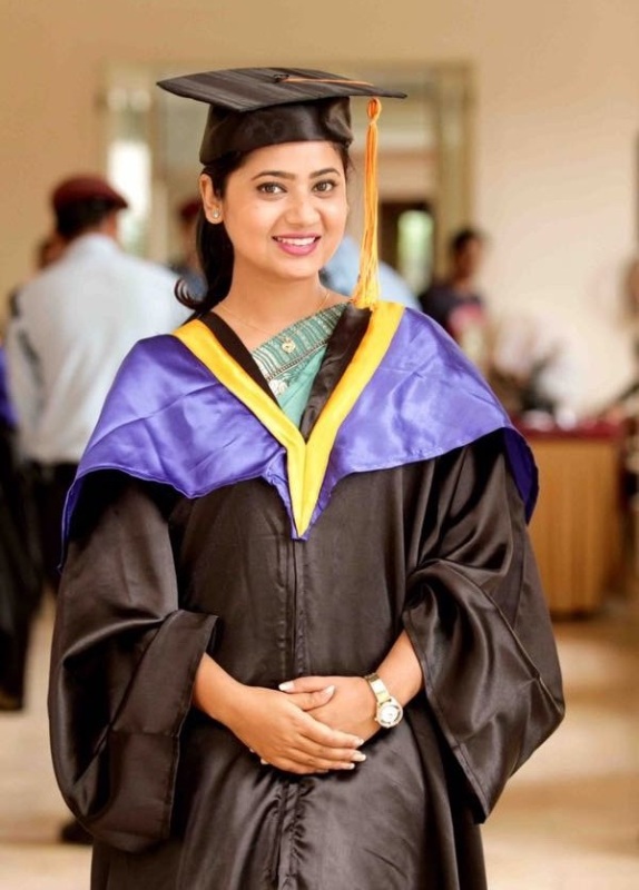 Keki Adhikari posing after attaining her MBA degree
