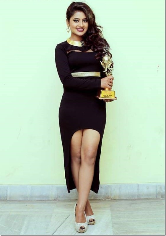Keki Adhikari while posing with one of her awards