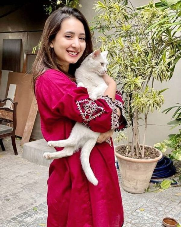 Komal Aziz Khan holding her pet cat