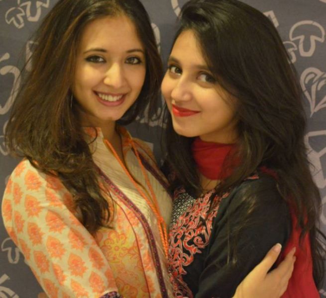Komal Aziz Khan with her younger sibling
