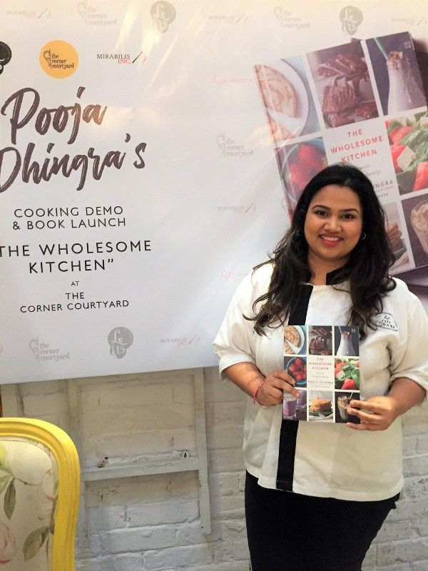 Pooja Dhingra with her book 'The Wholesome Kitchen'
