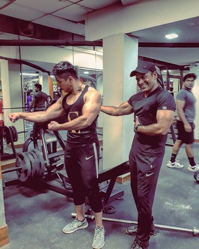 Pratik Sehajpal while working out in the gym