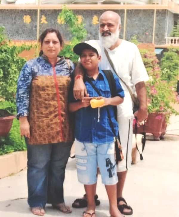Rishi Prabhakar with his wife and son