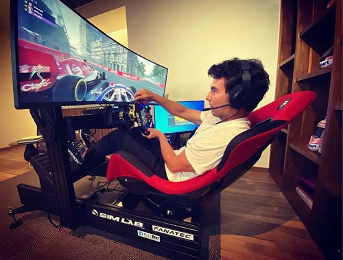Sergio Perez playing F1 on his home gaming setup