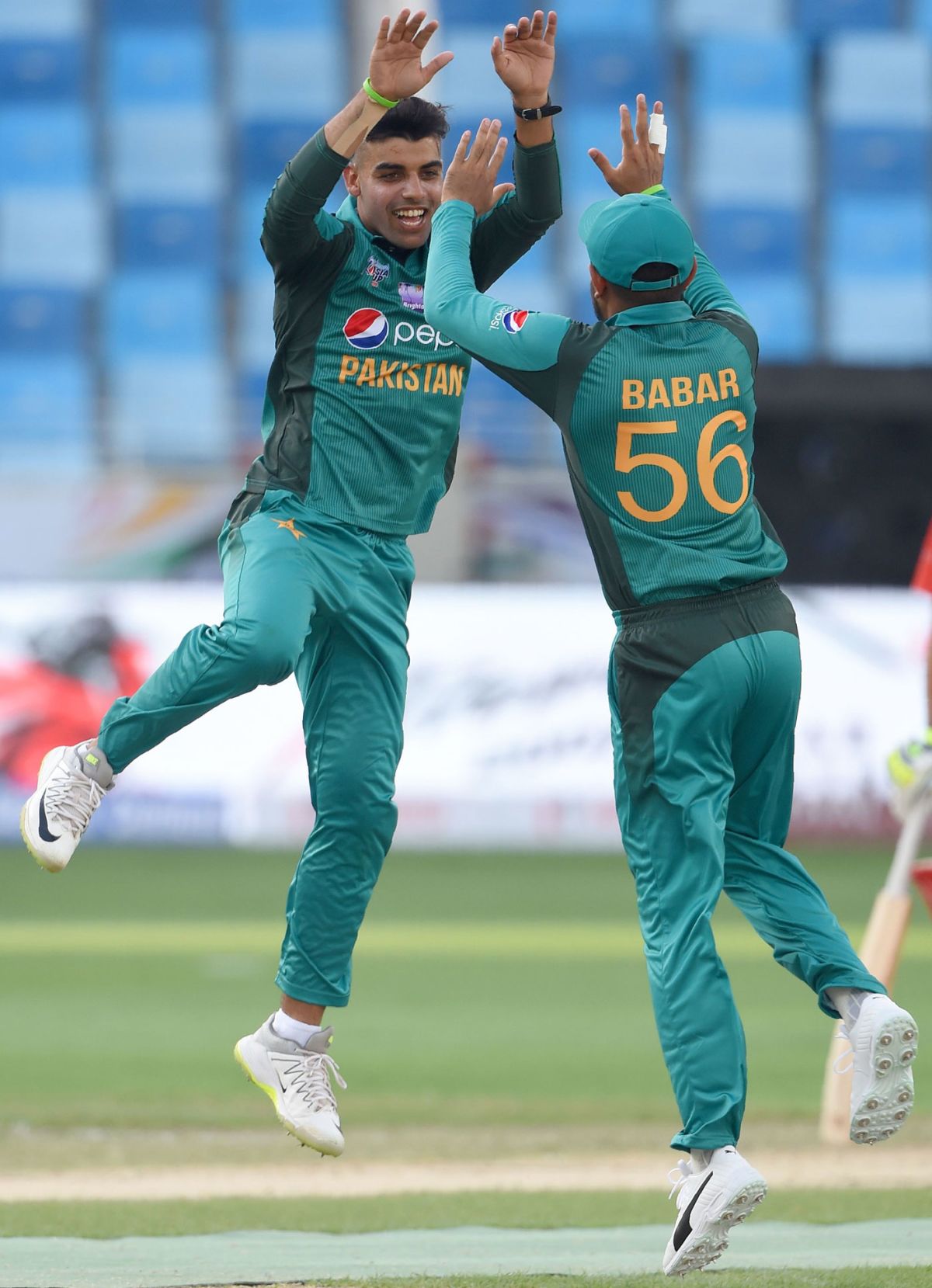 Shadab Khan celebrating after taking a wicket against Hong Kong