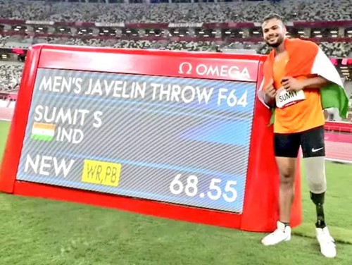 Sumit Antil with the scoreboard after making a world record in the 2020 Summer Paralympics