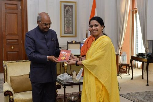Acharya Pratishtha gifting her book to the President of India Ram Nath Kovind