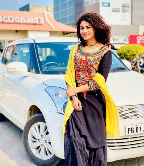 Harmilan Kaur with her car: Maruti Swift