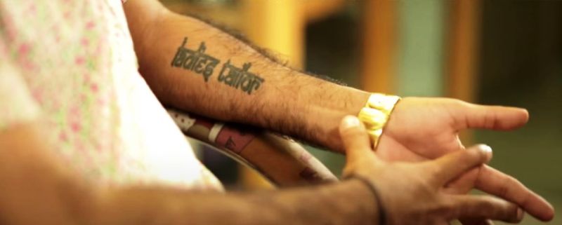 Ladies Tailor tattoo on Manish Arora's arm