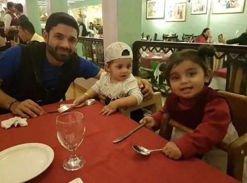 Mohammad Rizwan with his two daughter in a restaurant in Dubai