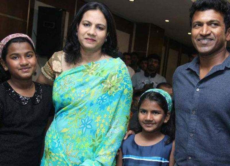 Puneeth Rajkumar with his wife and daughters