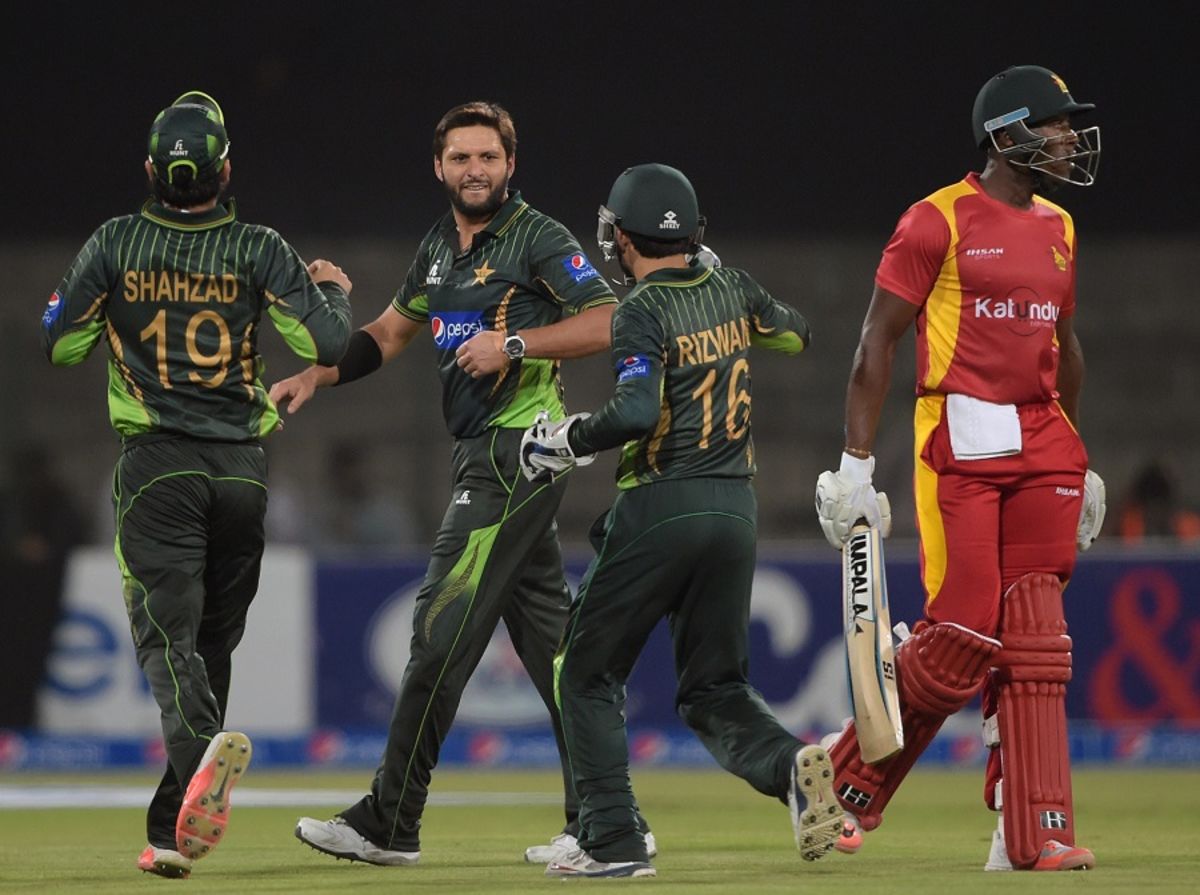 Rizwan celebrating the wicket with Shahid Afridi and other teammates