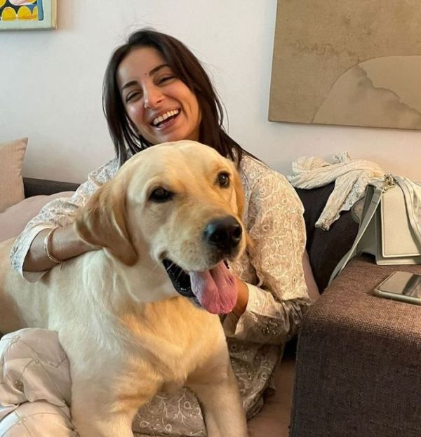 Sarwat Gilani cuddling with her dog Leo