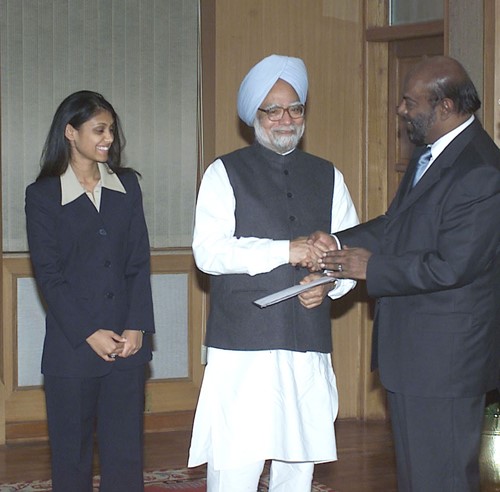 Shiv Nadar and his daughter, Roshni Nadar handing over a cheque for the Prime Minister Relief Fund