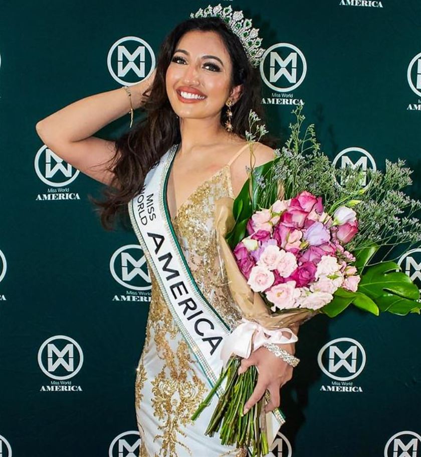 Shree Saini posing after winning the title Miss World America in 2021