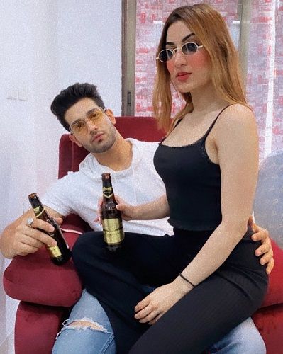 Suhani Chaudhary with a bottle of beer