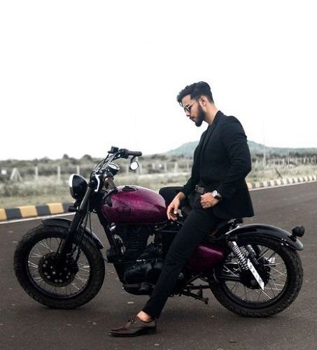 Vijay Mahar posing on his Bobber motorcycle