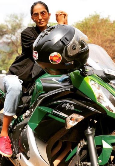 Aishwarya Sushmita posing with her bike.