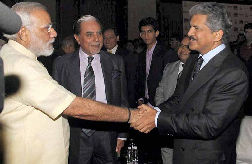 Anand Mahindra shaking hands with then Chief Minister of Gujarat Narendra Modi